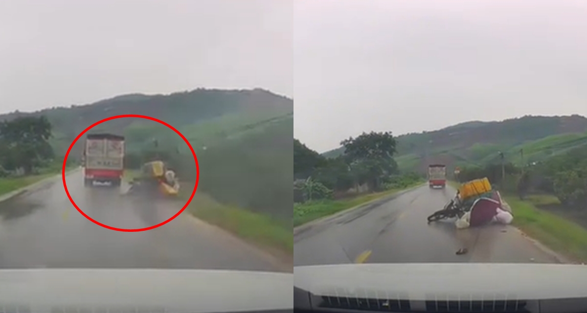Clip xe tải ngông nghênh húc người đi xe máy ngã lộn nhào giữa trời mưa rồi bỏ chạy gây chấn động MXH
