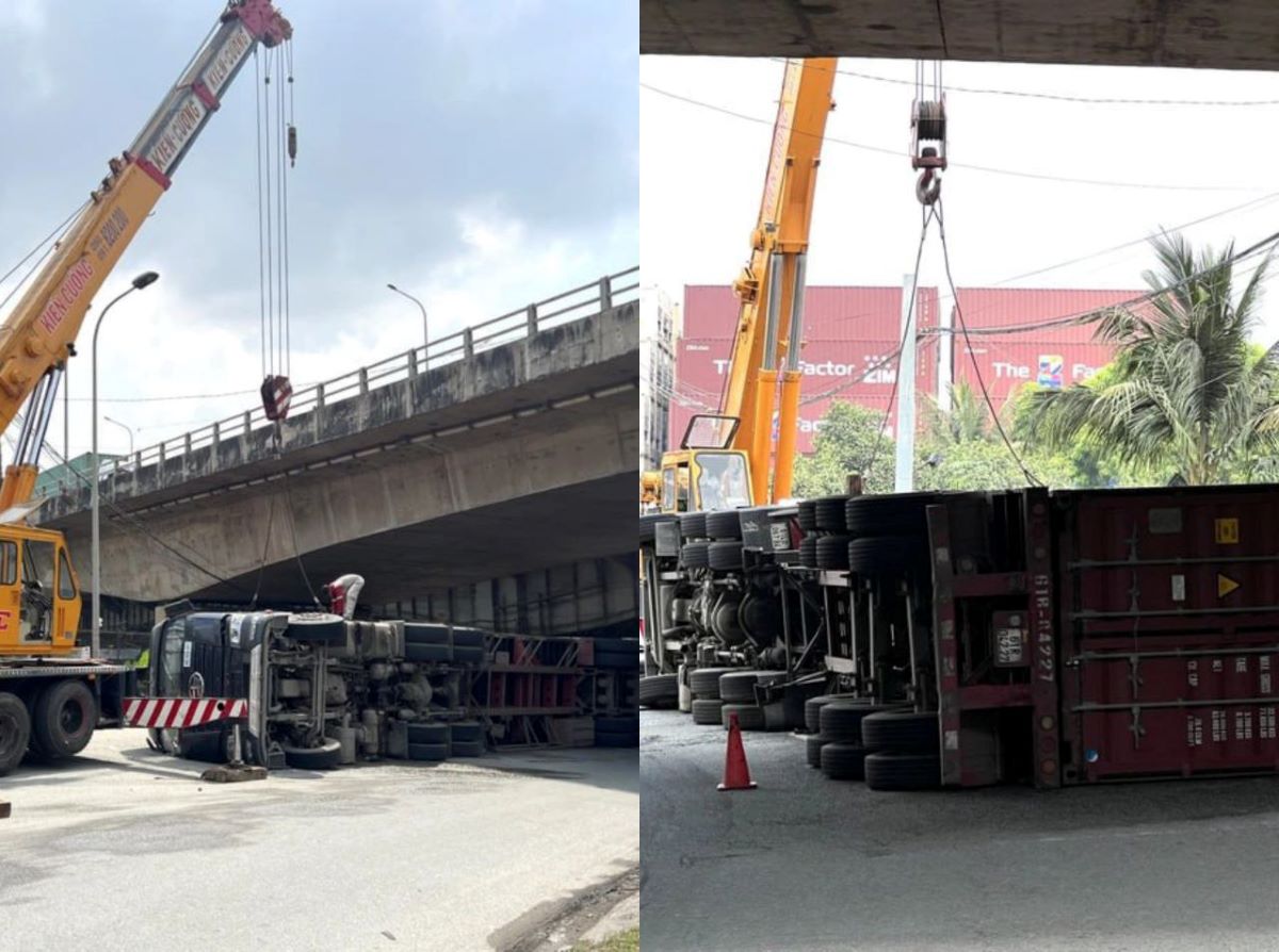 Hiện trường xe container chở 30 tấn h&agrave;ng lật ngửa dưới gầm cầu, t&agrave;i xế hiện ra sao?