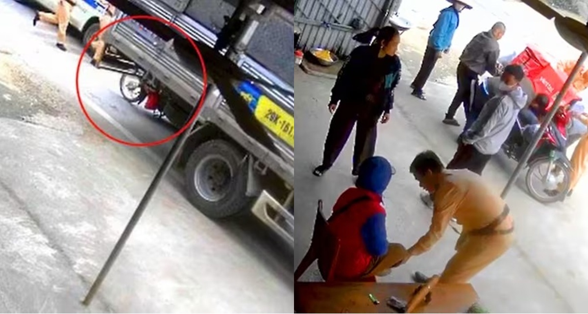 Nữ shipper bị cuốn v&agrave;o gầm xe tải v&igrave; mải nghe điện thoại, camera ghi lại khoảnh khắc được CSGT cứu sống