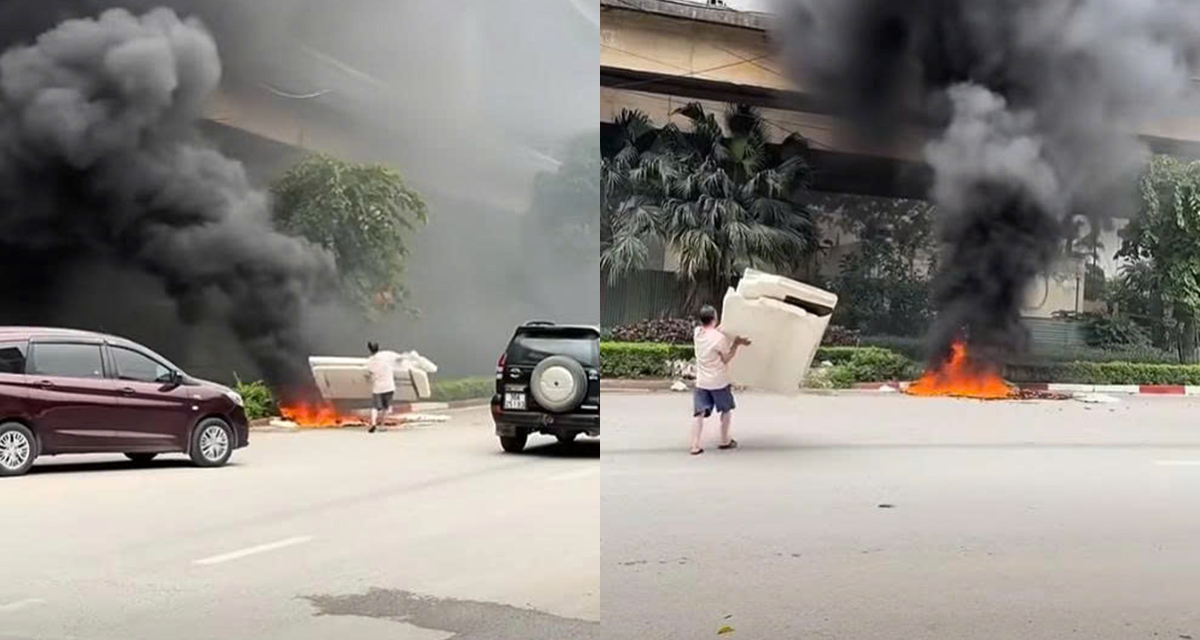 C&aacute;i kết cho người đ&agrave;n &ocirc;ng đốt r&aacute;c ở ch&acirc;n cầu Thăng Long &ndash; H&agrave; Nội khiến kh&oacute;i đen bao tr&ugrave;m