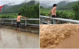 Xôn xao clip người đàn ông nhảy cầu xuống dòng nước lũ chảy xiết, người chứng kiến dửng dưng quay video