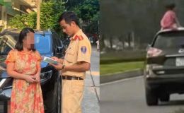 Clip bé gái trèo lên nóc ô tô gây xôn xao: Người mẹ bị phạt nặng, kể lại phút giật mình khi đang lái xe