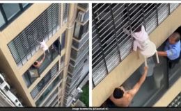 Nghẹt thở khoảnh khắc giải cứu bé gái 3 tuổi treo lơ lửng trên cửa sổ tầng 12 của 1 tòa chung cư