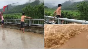 Xôn xao clip người đàn ông nhảy cầu xuống dòng nước lũ chảy xiết, người chứng kiến dửng dưng quay video
