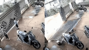 Camera ghi lại cảnh cánh cửa sắt đổ rầm trong lúc 2 bé trai đang đóng cửa khiến người xem thót tim