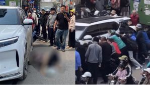 Camera ghi lại giây phút kinh hoàng ô tô lùi ở Hà Nội, 1 người tử vong tại chỗ, hàng chục người nâng xe cứu nạn nhân