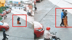 Pha xử lý gây xôn xao MXH: Clip nam bảo vệ chạy ra bế người phụ nữ mải nghe điện thoại, chắn lối ô tô đi