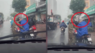Clip người đàn ông tát liên tiếp vào mặt, dùng tay ghì cổ tài xế xe ôm công nghệ giữa trời mưa