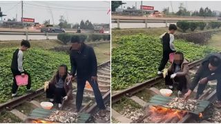 Xôn xao clip ghi lại cảnh 1 nam 1 nữ thản nhiên nướng đồ ăn trong đường tàu