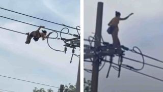 Camera ghi lại cảnh người phụ nữ bò làm xiếc trên đường dây điện, rơi xuống đất trong tiếng la hét