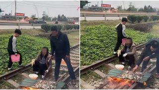 Xôn xao clip ghi lại cảnh 1 nam 1 nữ thản nhiên nướng đồ ăn trong đường tàu