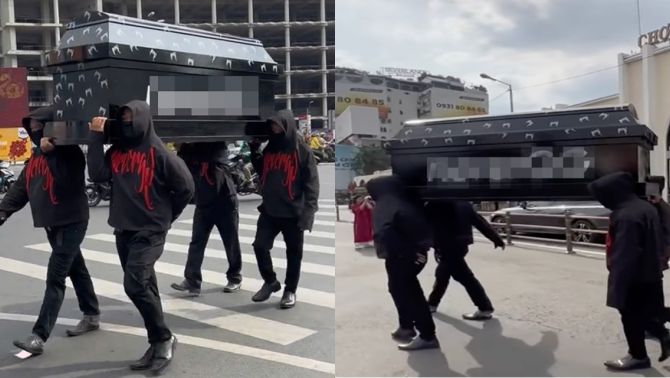 Nhóm 9 thanh niên mặc đồ đen khai nhận lý do khiêng quan tài diễu hành trước chợ Bến Thành 