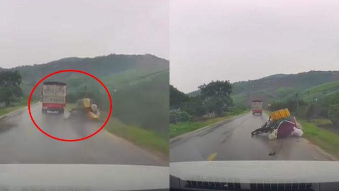 Clip xe tải ngông nghênh húc người đi xe máy ngã lộn nhào giữa trời mưa rồi bỏ chạy gây chấn động MXH