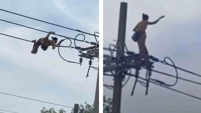 Camera ghi lại cảnh người phụ nữ bò làm xiếc trên đường dây điện, rơi xuống đất trong tiếng la hét