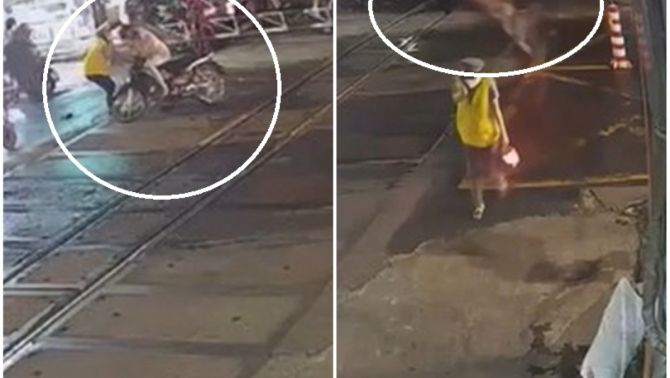 Thanh niên đi xe máy lao thẳng vào rào chắn lúc tàu đang đến gần: Cái kết khiến người xem 'đứng tim'