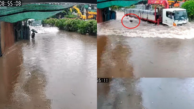 Clip ghi lại cảnh thót tim giữa phố ngập lụt ở Hà Nội: Tài xế lao nhanh tạo sóng lớn, suýt cán trúng người đi bộ