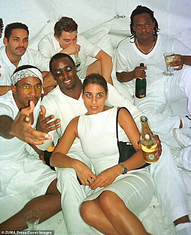 90839161-13958973-Sean_Diddy_Combs_surrounded_by_guests_at_his_annual_white_partie-a-1_1728936551539_11zon