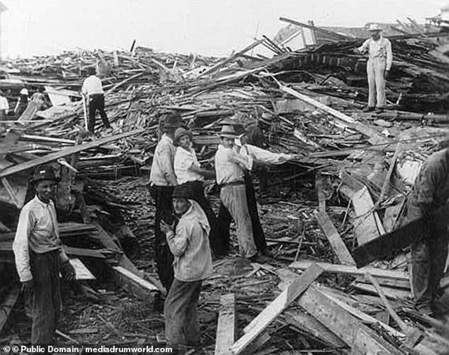 90618939-13937517-A_disaster_relief_party_search_for_bodies_in_the_city_that_was_o-a-41_1728423809661_11zon