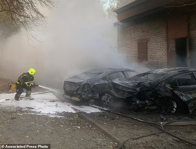 92197643-14097043-Above_Ukrainian_Emergency_Service_personnel_work_to_extinguish_a-a-9_1731953292247_11zon
