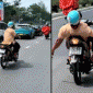 Nhiều người khiếp vía trước cảnh người đàn ông mất tay phải nằm ngửa trên xe và lạng lách trên đường